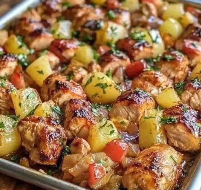 Sliced chicken breasts marinating in a bowl with teriyaki sauce, honey, and soy sauce.